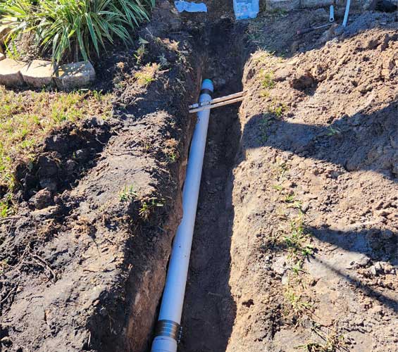 SCH 40 PVC Sewer Line Replacement in a trench at a home in Tampa