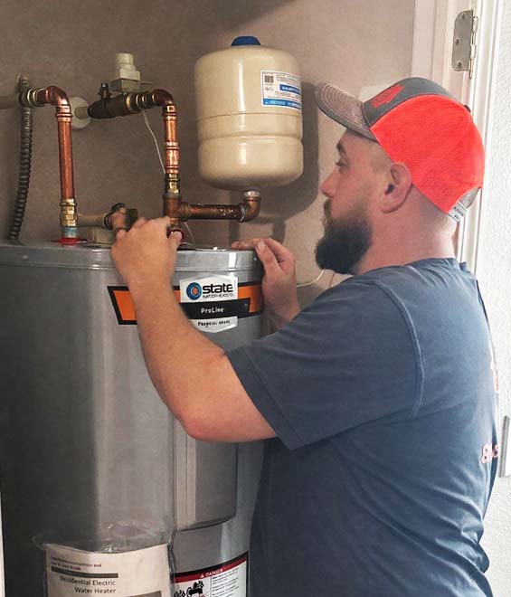 All Hours Plumber Servicing an Electric Water Heater in Wesley Chapel.