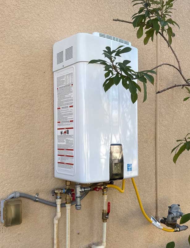 Navien NPE-240A Natural Gas Tankless Water Heater Installed by All Hours Plumber on the outside wall of a Tampa Home.