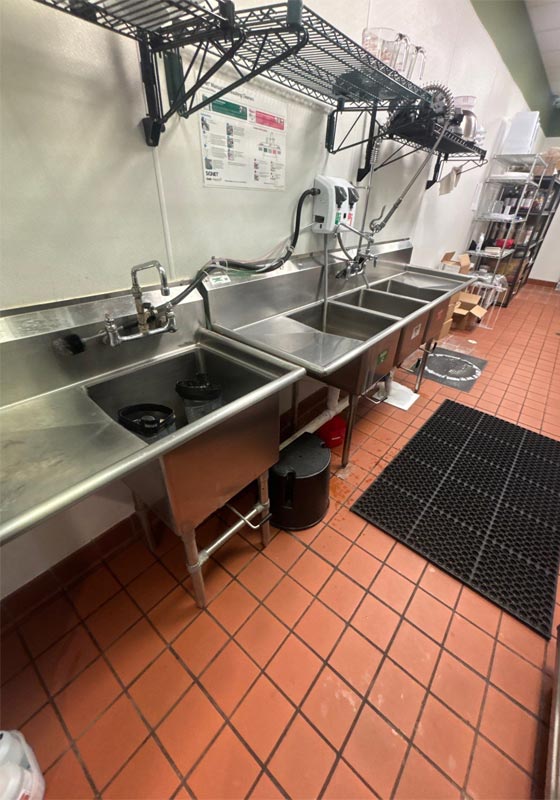 Commercial kitchen with stainless steel sinks in a restaurant in Tampa, FL