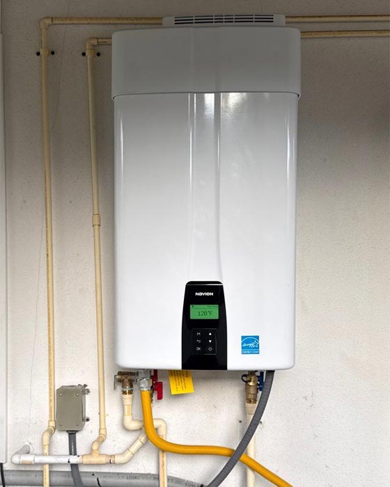 Navien tankless gas water heater installed on a garage wall by All Jours Plumber n Largo, FL