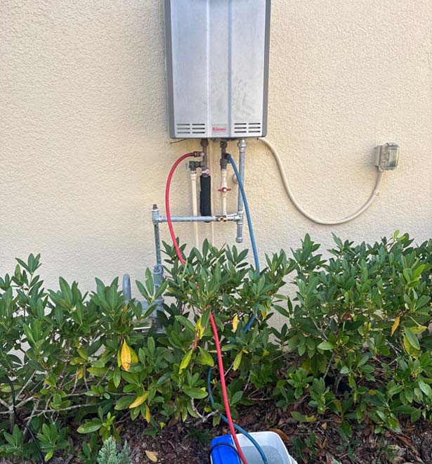Tankless water heater in the process of descaling for yearly maintenance.